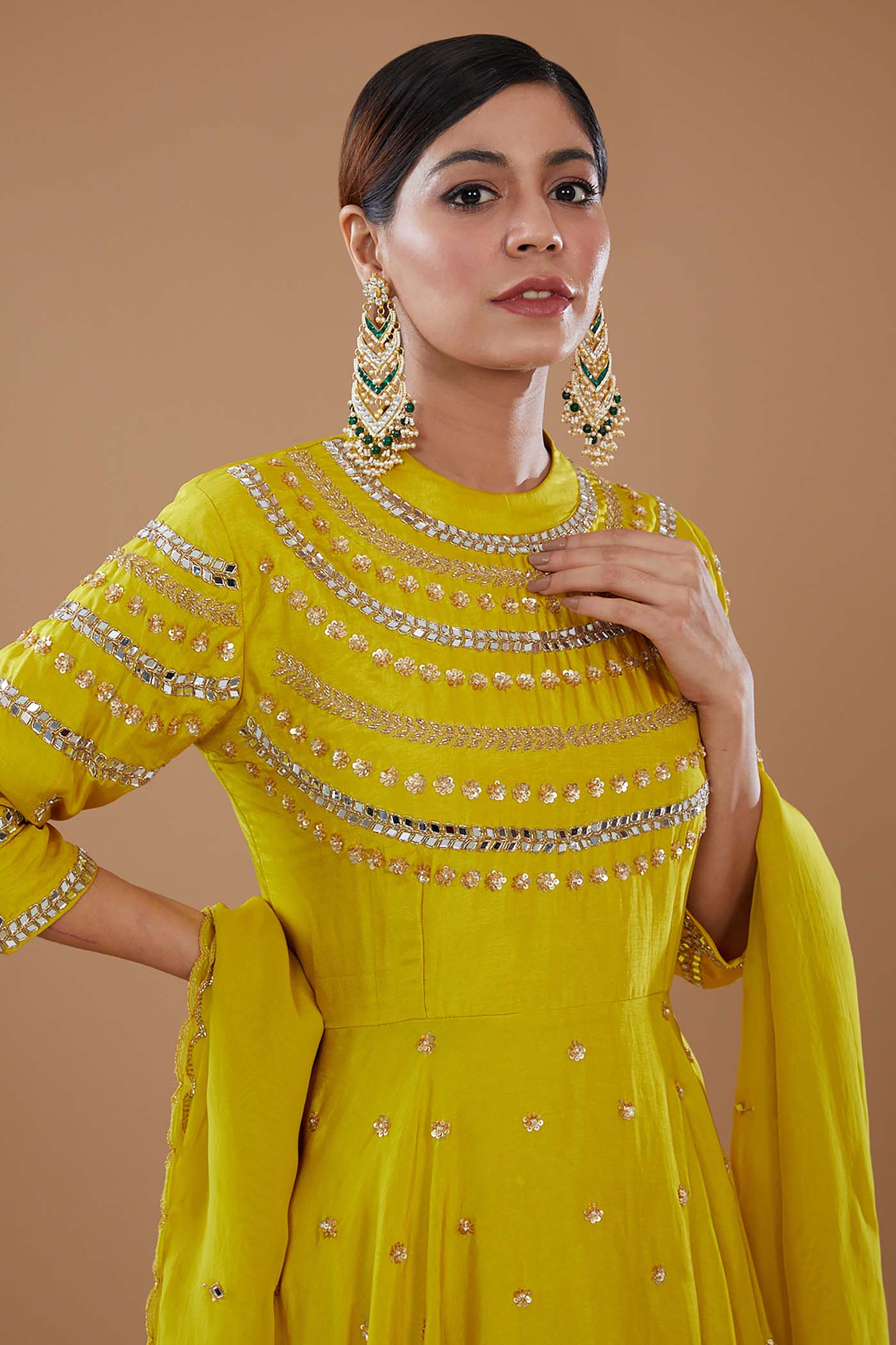 Mustard Short Anarkali with heavily Embroidered yoke and sleeves Comes with a Skirt and Dupatta