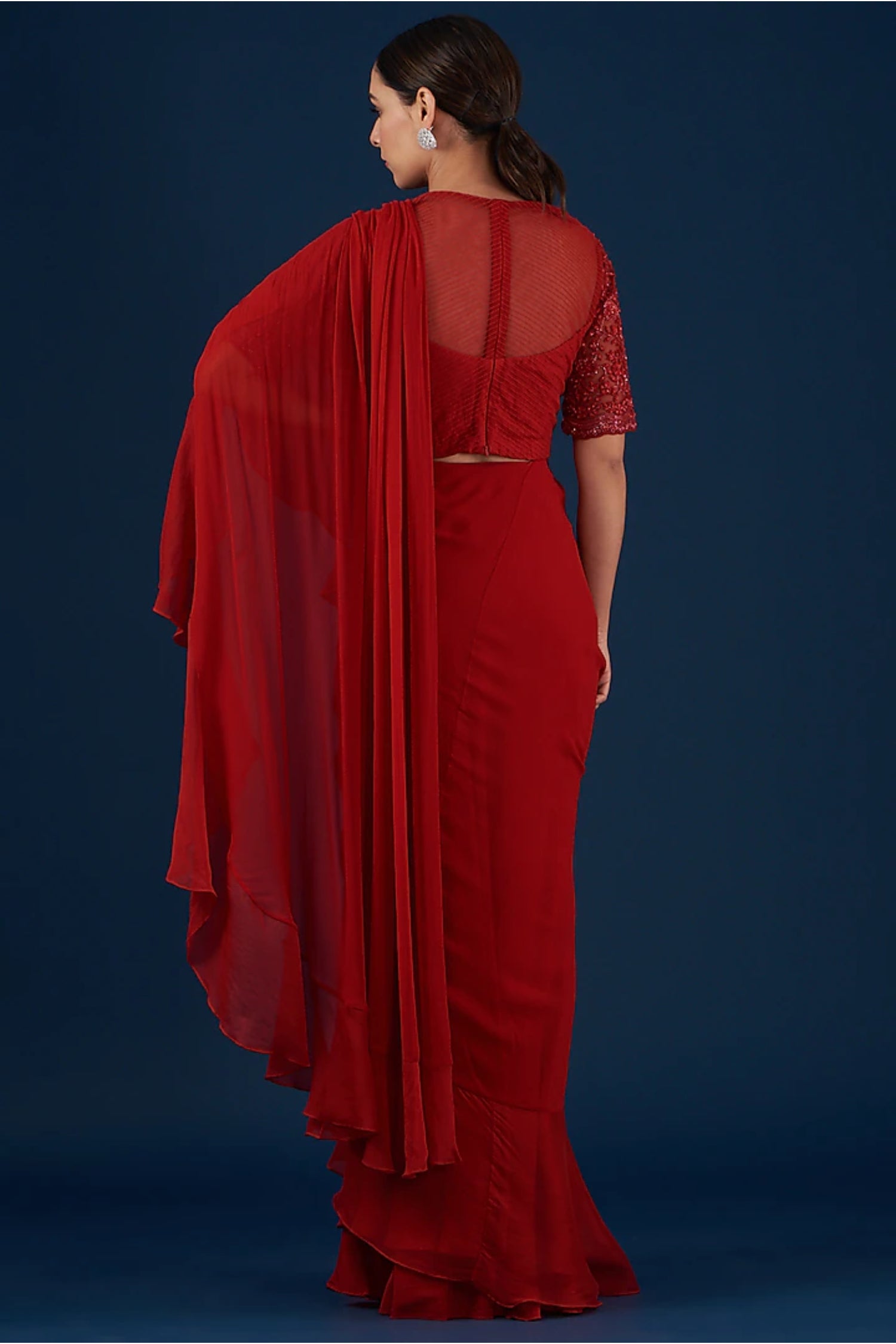 Red Drape Ruffed Saree Comes With Embroidered Blouse And Belt.