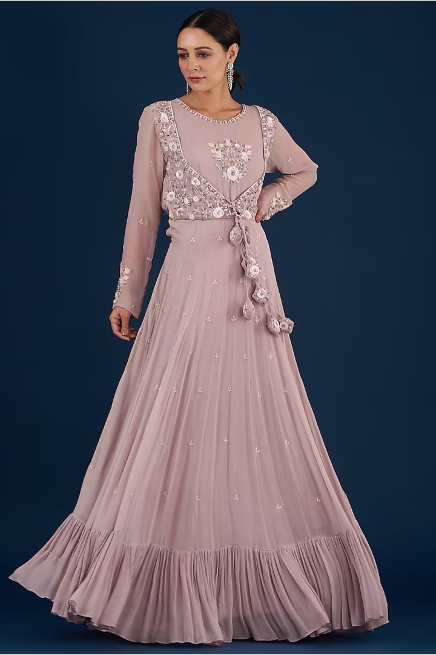 Lilac Tiered Anarkali With Attached Jacket And Heavy Tassles.