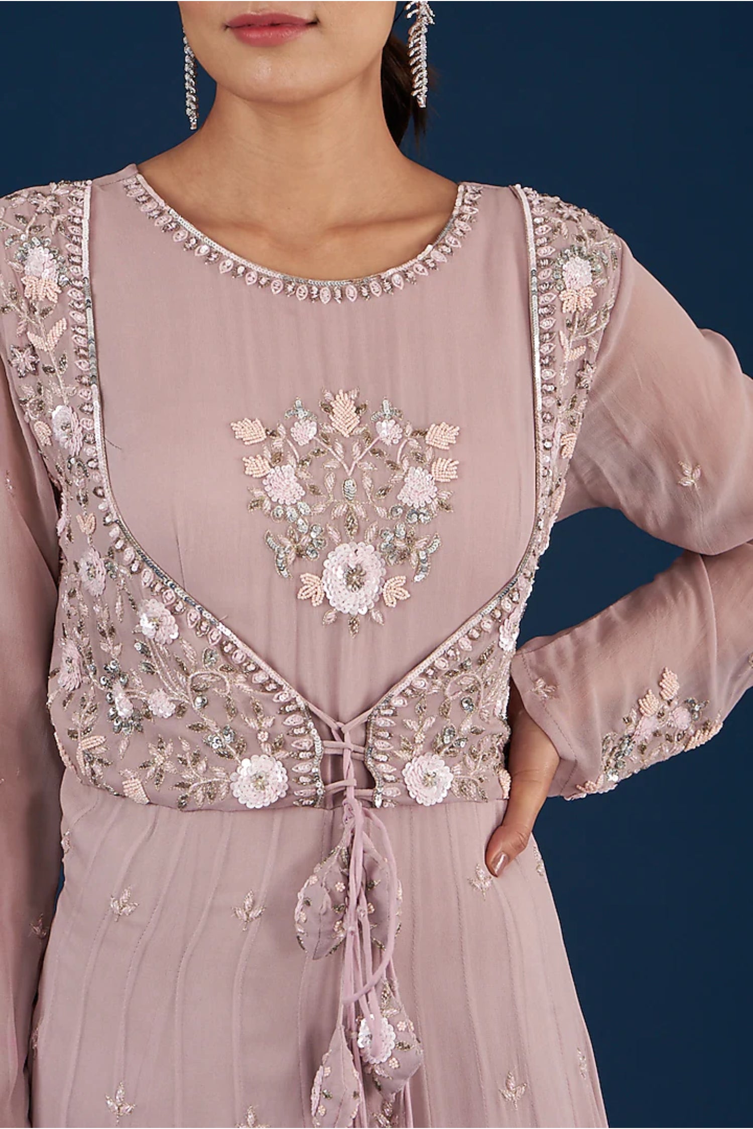 Lilac Tiered Anarkali With Attached Jacket And Heavy Tassles.