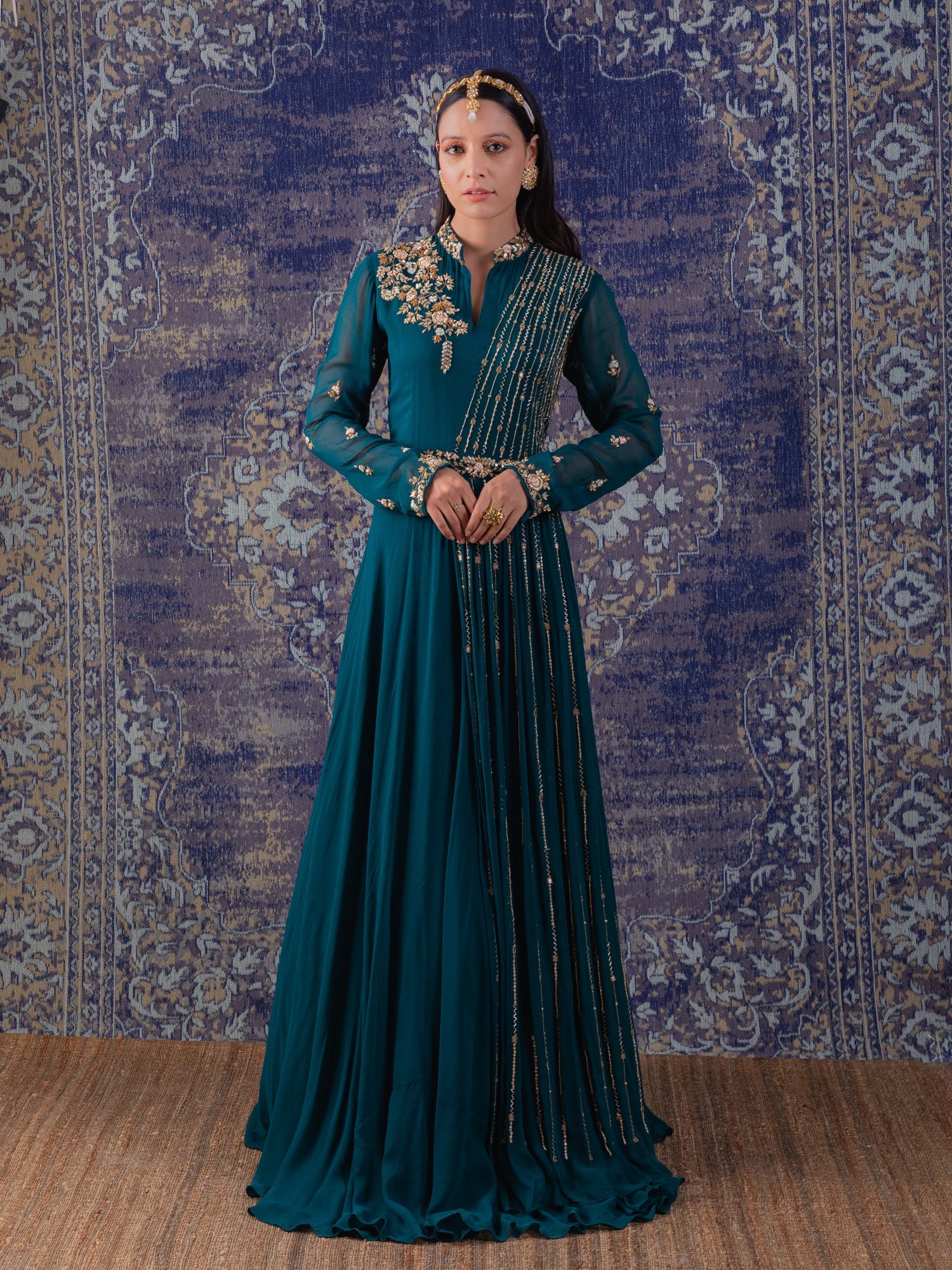 Rama Green Gown With Heavily Embroidered Drape And Floral Work On Neckline And Belt.