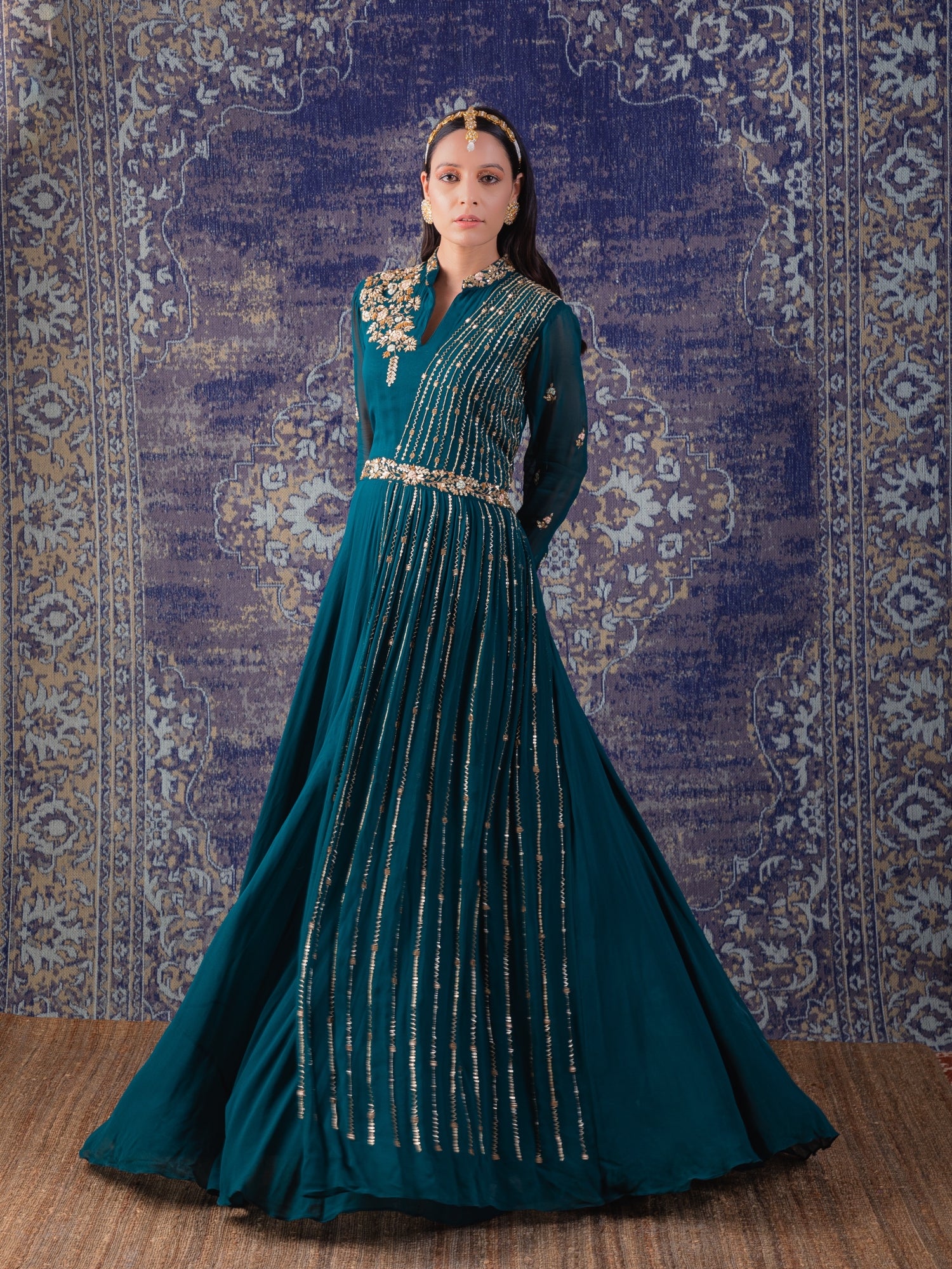 Rama Green Gown With Heavily Embroidered Drape And Floral Work On Neckline And Belt.
