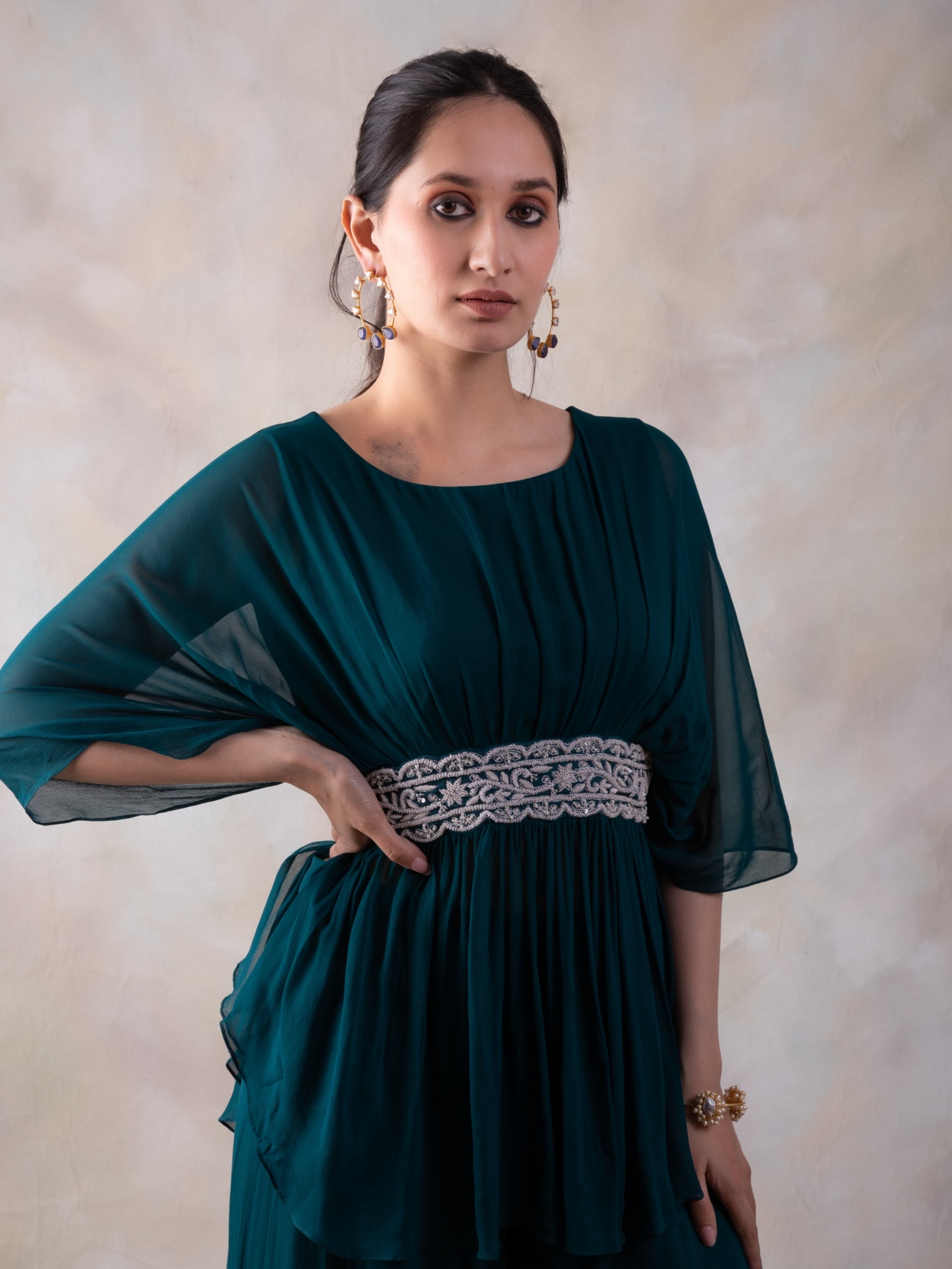 Rama Green Peplum Top With Hand Embroidery On The Waist Paired With A Sharara.