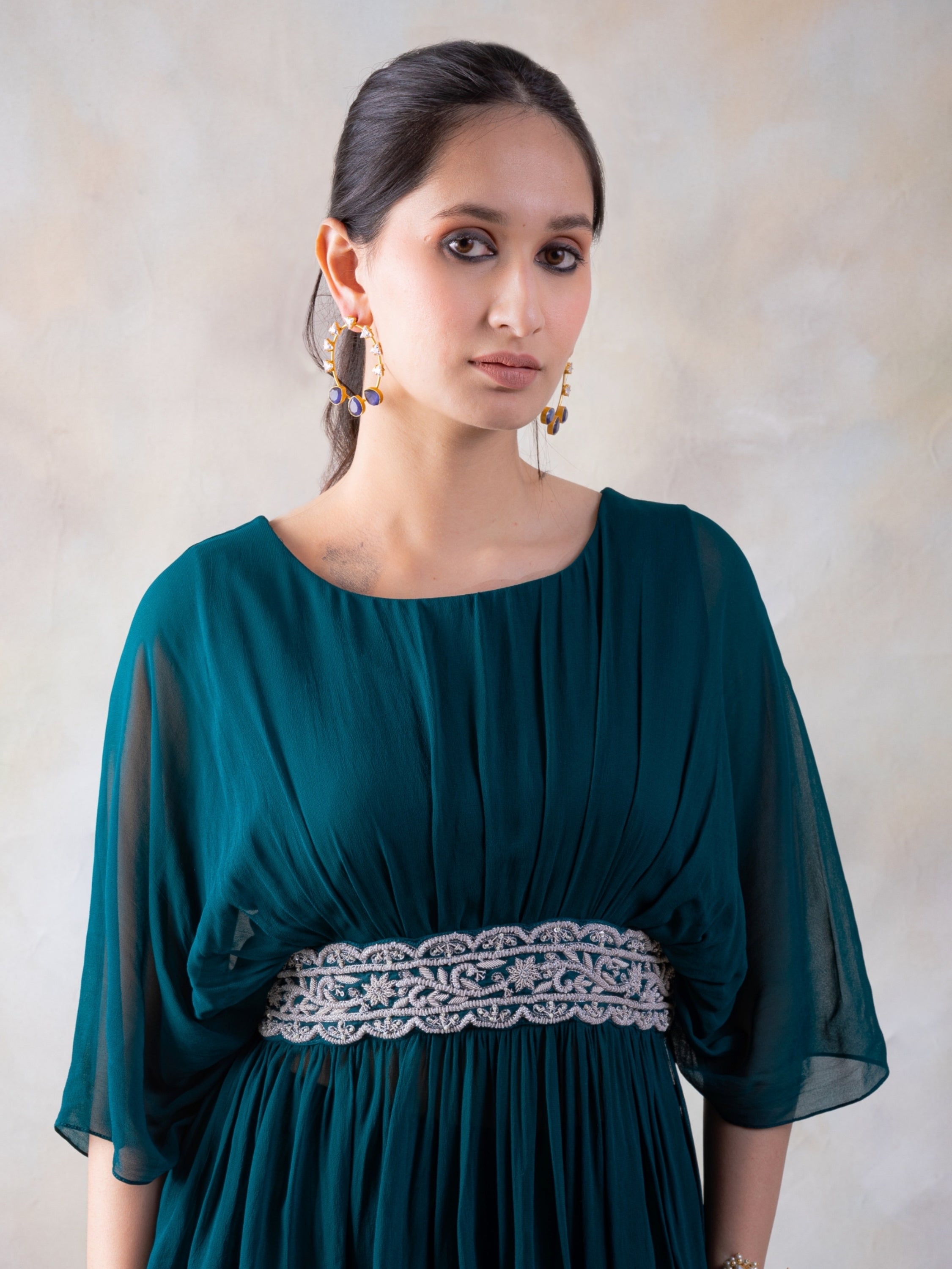 Rama Green Peplum Top With Hand Embroidery On The Waist Paired With A Sharara.