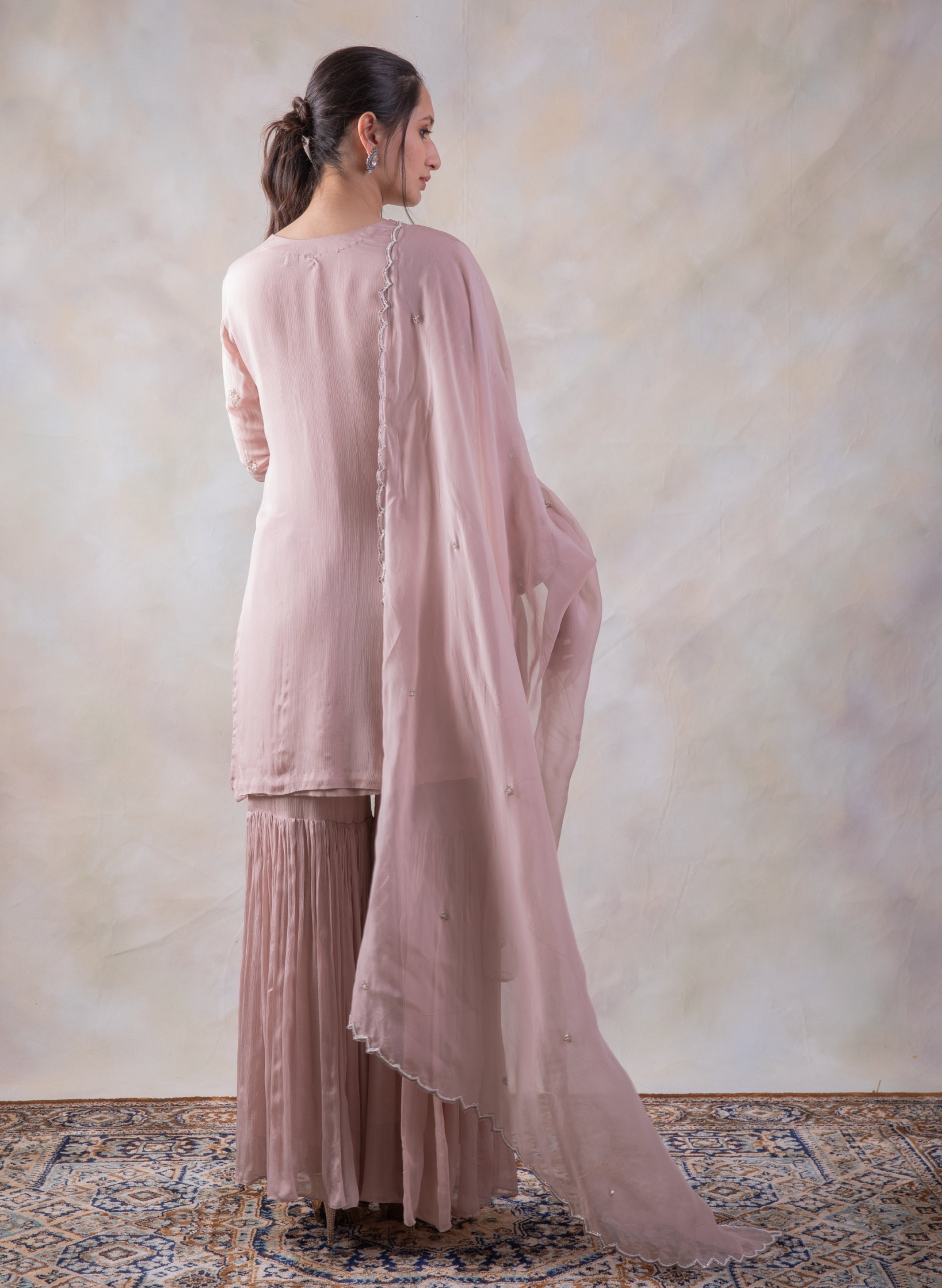 Onion Pink Sharara With Mesmerizing Cut-Dana Kurta And Dupatta.