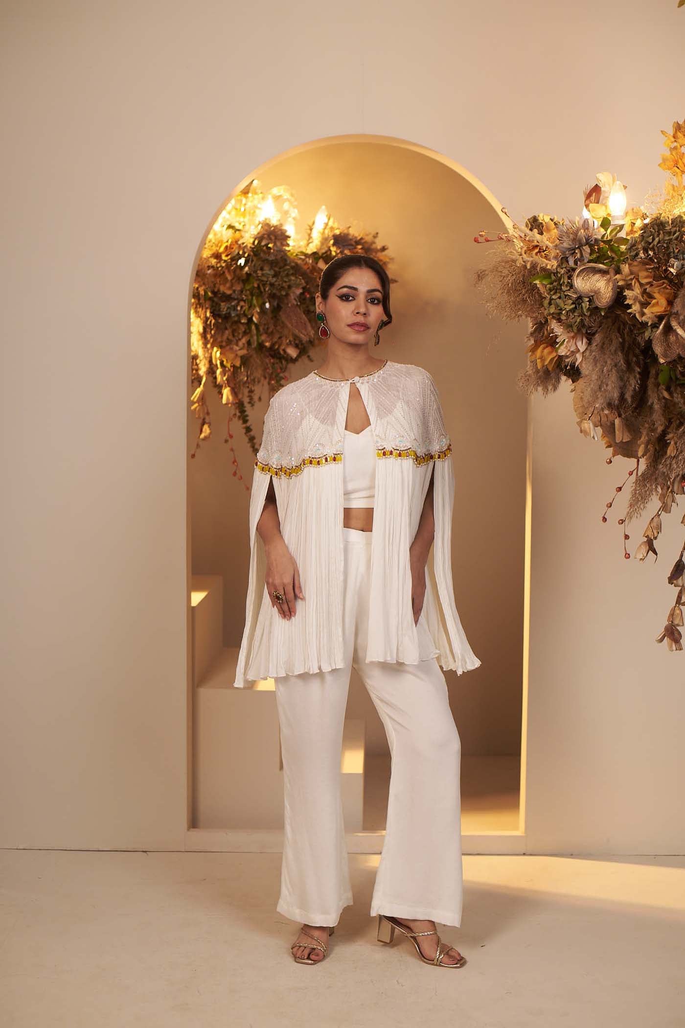 Pearl White has a flowy pant and blouse Set