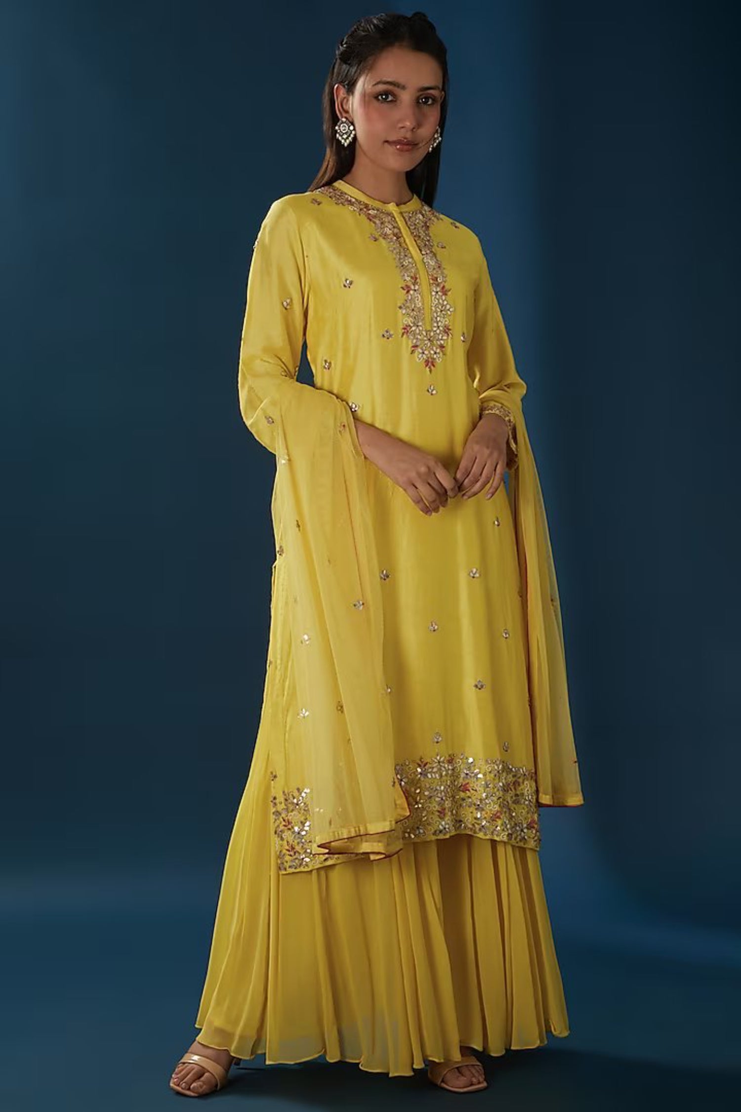 Yellow Embroidered Straight Kurta Comes With A Sharara And Dupatta.