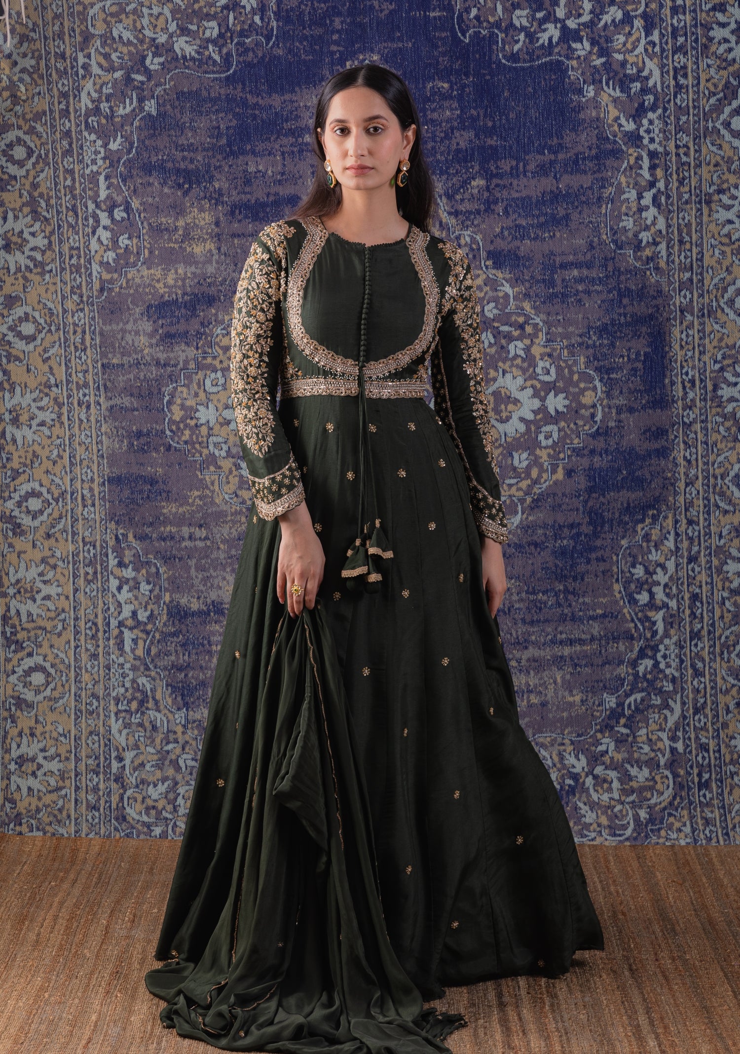 Mehendi Green Anarkali With Heavily Embroidered
Yoke And Sleeves With A Dupatta.