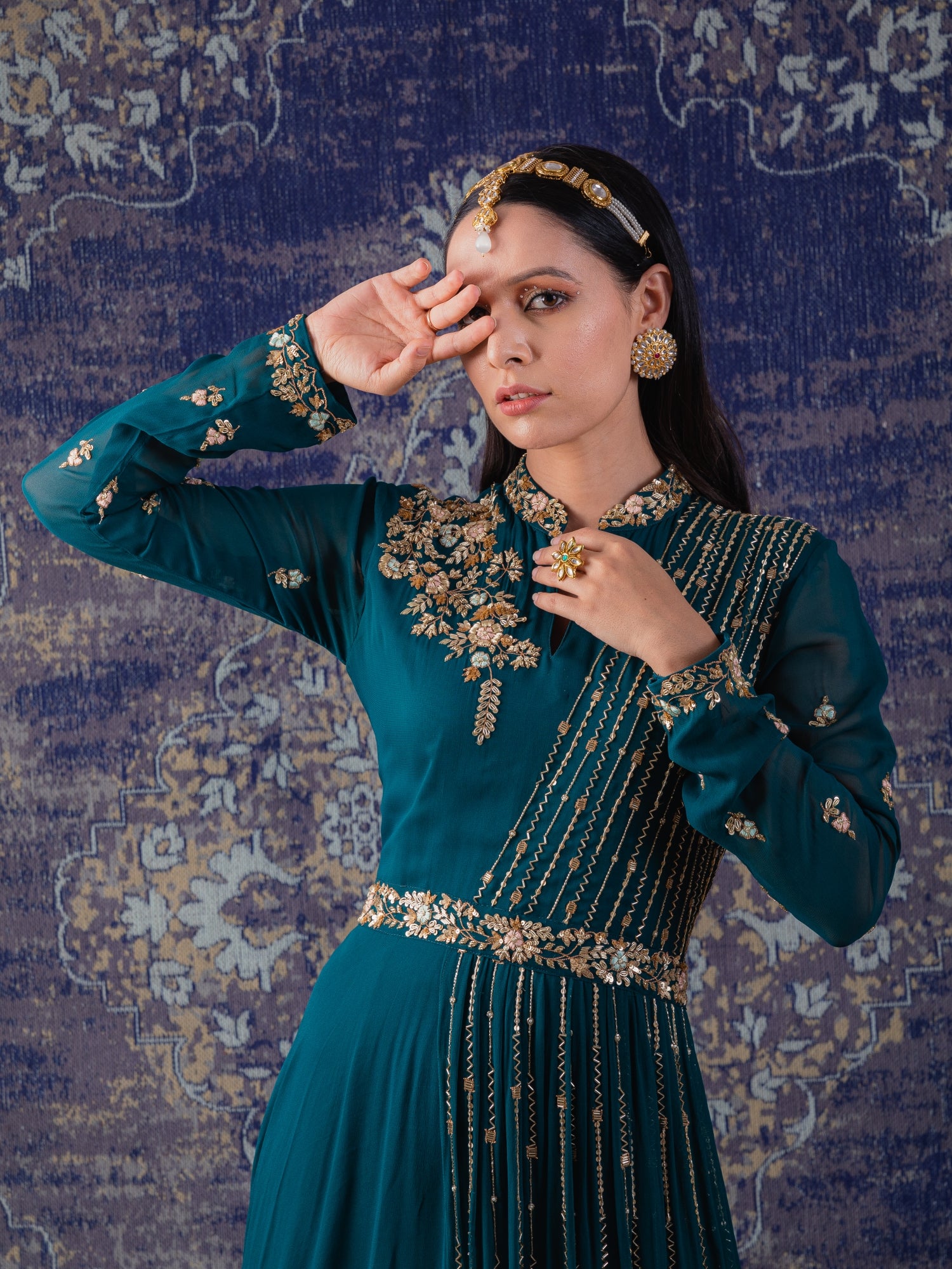 Rama Green Gown With Heavily Embroidered Drape And Floral Work On Neckline And Belt.