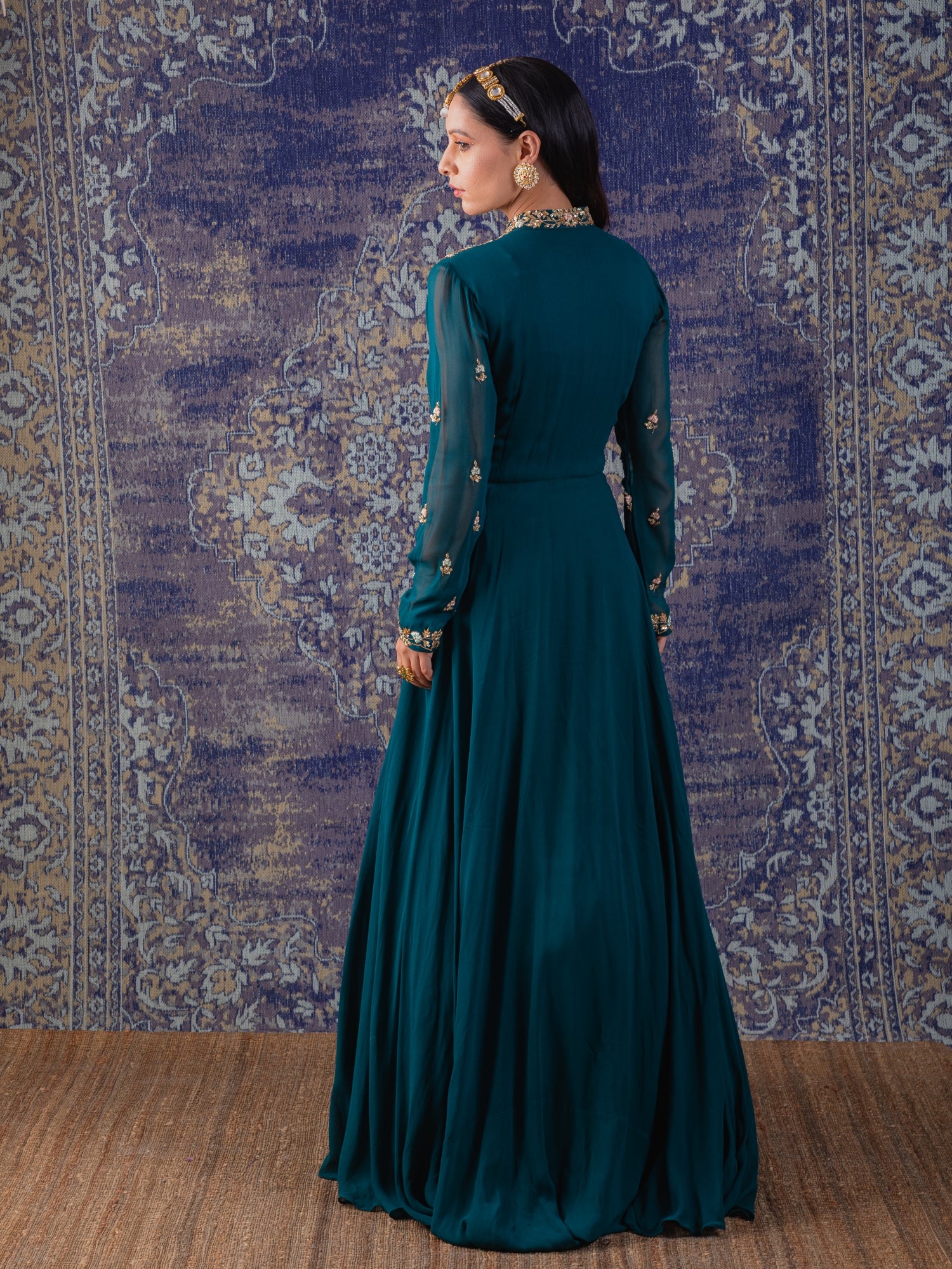 Rama Green Gown With Heavily Embroidered Drape And Floral Work On Neckline And Belt.