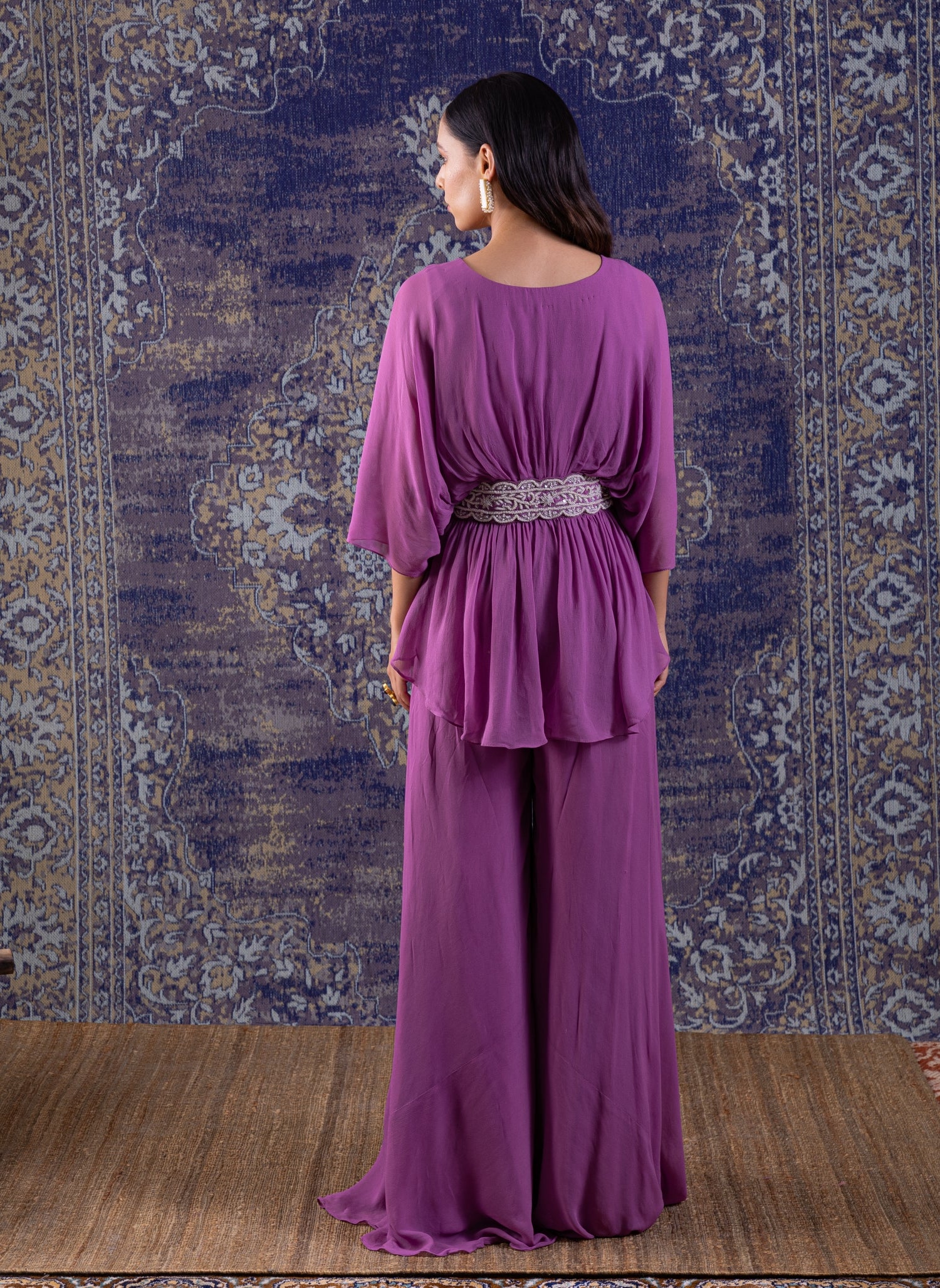 Lilac Peplum Top With Hand Embroidery On The Waist Paired With A Sharara.