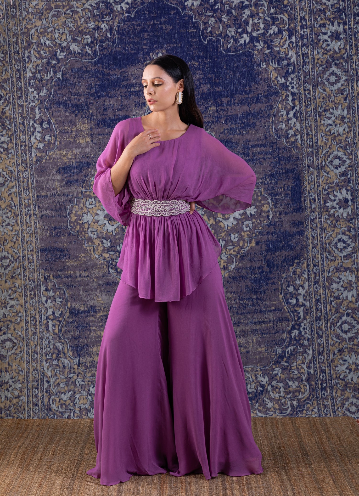 Lilac Peplum Top With Hand Embroidery On The Waist Paired With A Sharara.