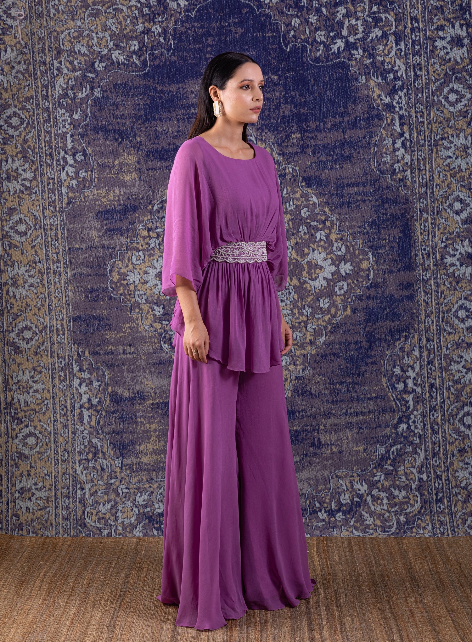 Lilac Peplum Top With Hand Embroidery On The Waist Paired With A Sharara.