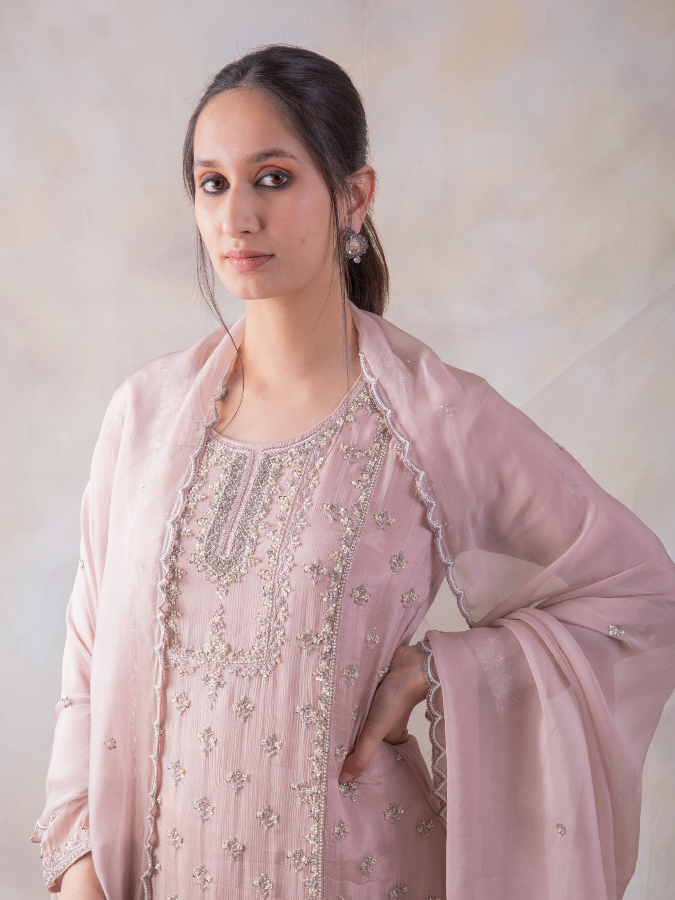 Onion Pink Sharara  With Mesmerizing Cut-Dana Kurta And Dupatta.