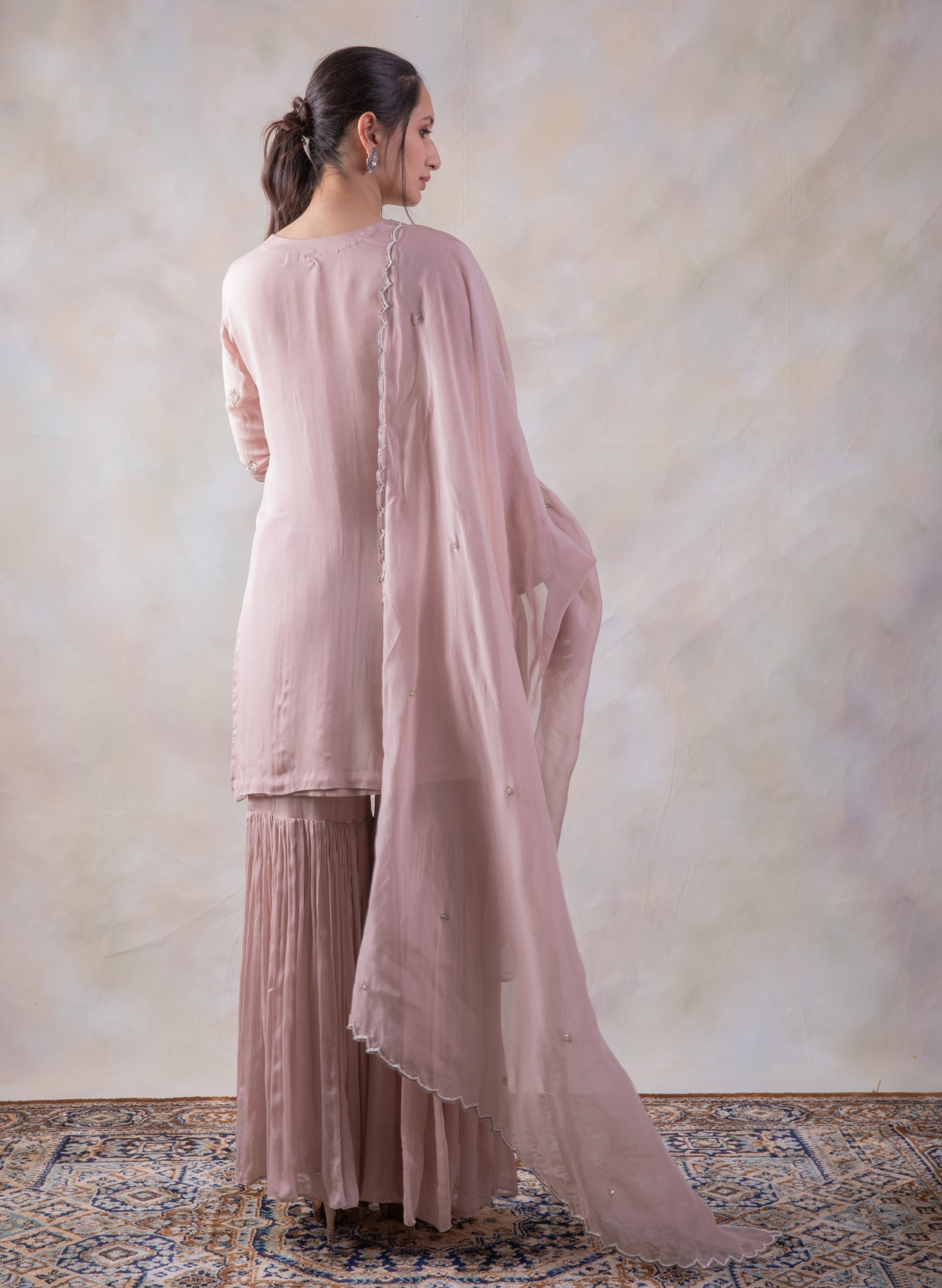 Onion Pink Sharara  With Mesmerizing Cut-Dana Kurta And Dupatta.