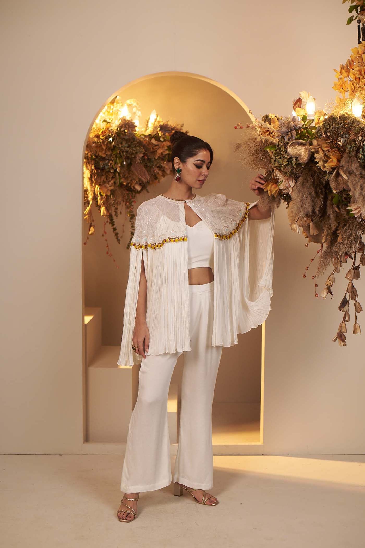 Pearl White has a flowy pant and blouse Set