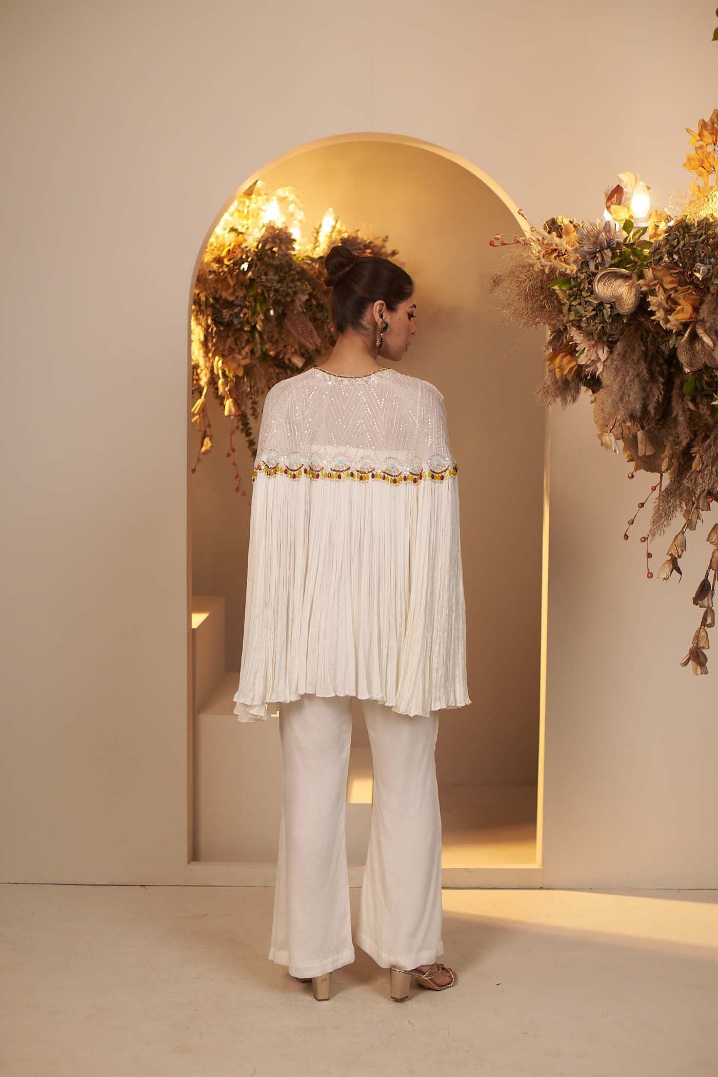 Pearl White has a flowy pant and blouse Set