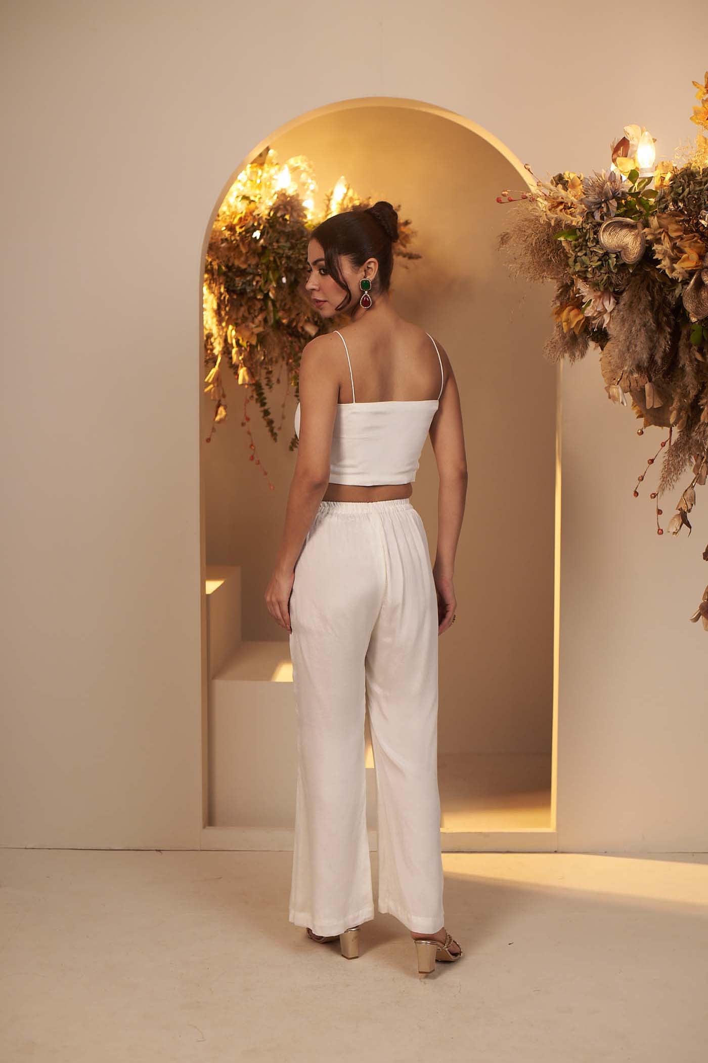 Pearl White has a flowy pant and blouse Set