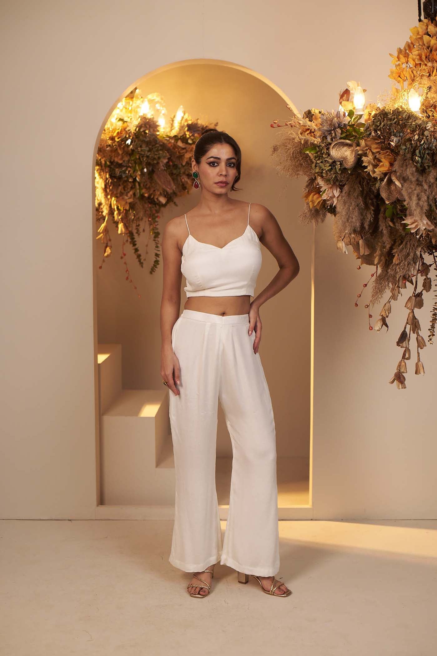 Pearl White has a flowy pant and blouse Set